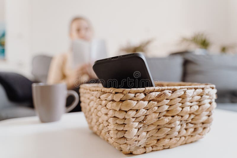 Millennial girl at home refuse using phone and reading a book. Social media addiction. Waste of time. Unplugged. Dependance concept. High quality 4k footage. Millennial girl at home refuse using phone and reading a book. Social media addiction. Waste of time. Unplugged. Dependance concept. High quality 4k footage