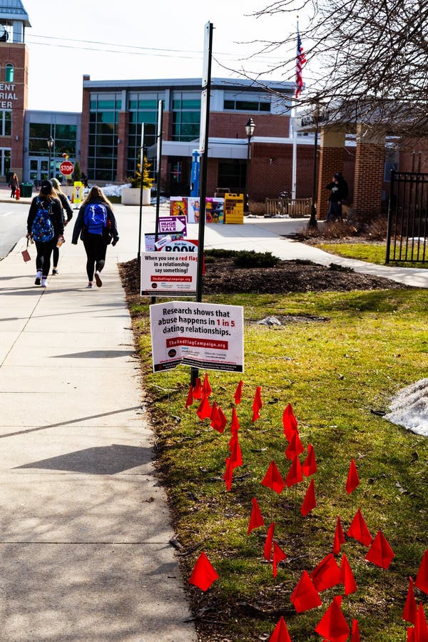 Millersville, PA, USA - February 22, 2016: Students are reminded that if they see red flags in a dating relationship to seek help. Millersville, PA, USA - February 22, 2016: Students are reminded that if they see red flags in a dating relationship to seek help