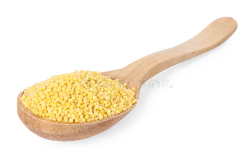 Millet groats in wooden spoon isolated on white stock image