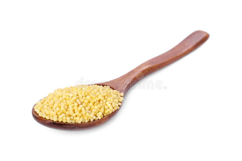 Millet groats in wooden spoon isolated on white royalty free stock photography