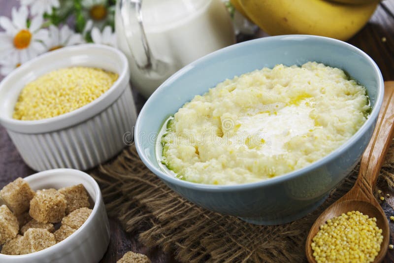 Millet porridge with milk stock photo. Image of spoon 183324010