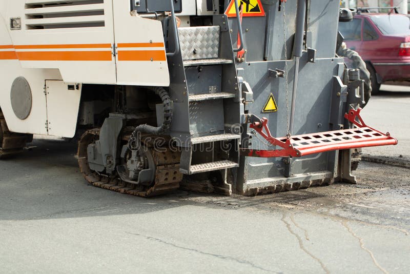 Milling of Asphalt for Road Reconstruction. Stock Photo Image of