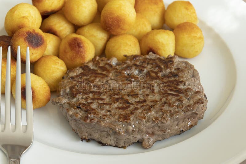 Minced Beef Steak and Dauphine Potatoes Cooked on Baking Paper Stock