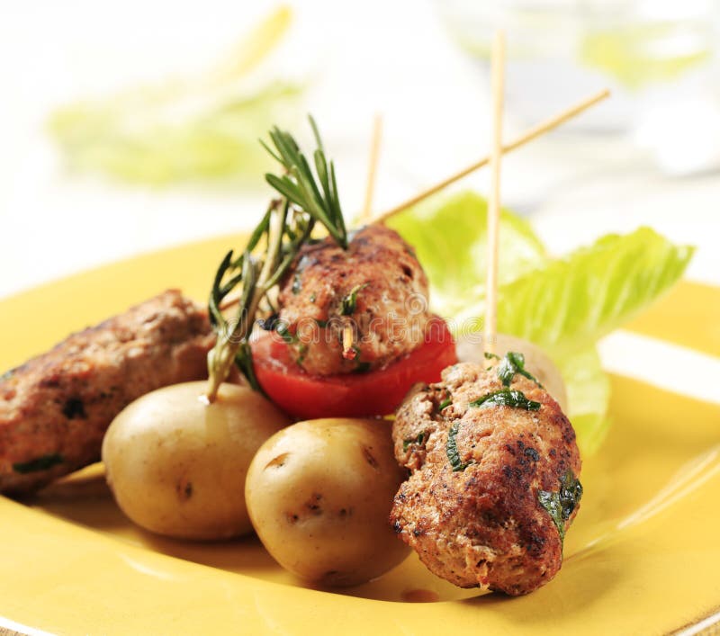 Minced meat kebabs and new potatoes