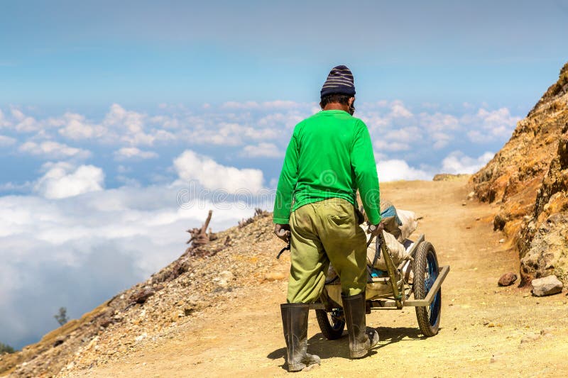 Miner inside volcano Ijen stock image