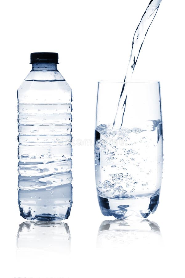 Mineral water in glass and bottle royalty free stock photos