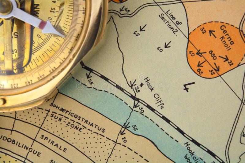 An old surveying compass on an out-of-copyright geological ressearch map, showing different rock strata and palaeontological zpnes, fault lines and dipped bedding planes, symbolising mineral exploration or geological mapping. An old surveying compass on an out-of-copyright geological ressearch map, showing different rock strata and palaeontological zpnes, fault lines and dipped bedding planes, symbolising mineral exploration or geological mapping.