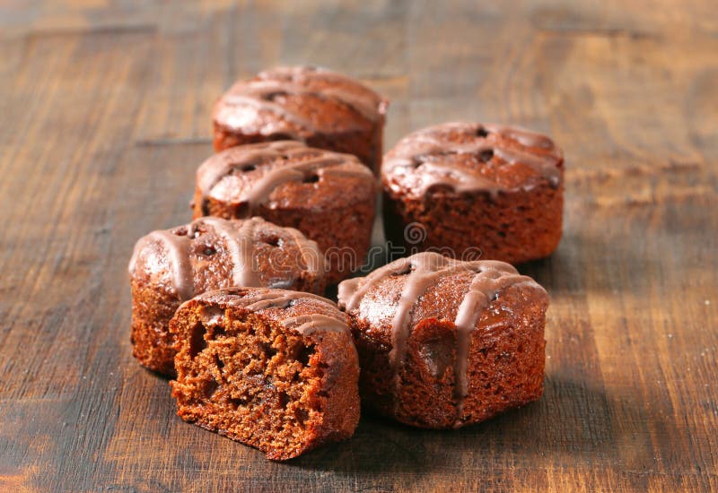 Mini chocolate cakes on wooden background. Mini chocolate cakes on wooden background