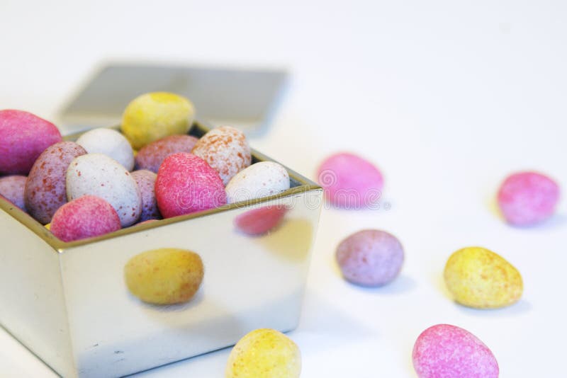 Mini candy chocolate eggs in a polished silver box