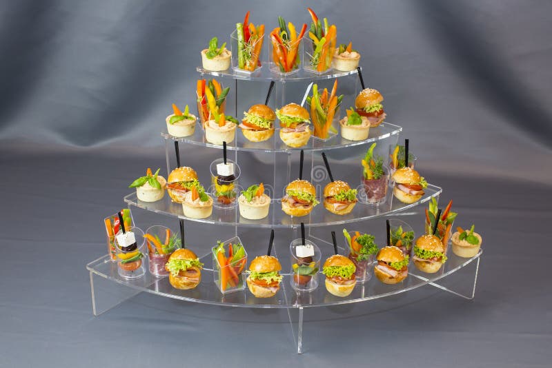 Mini desserts and meat canapes vegetable snacks