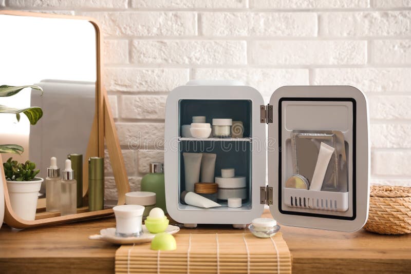 Mini Fridge with Cosmetic Products on White Vanity Table Stock Photo -  Image of lipstick, fridge: 214507050