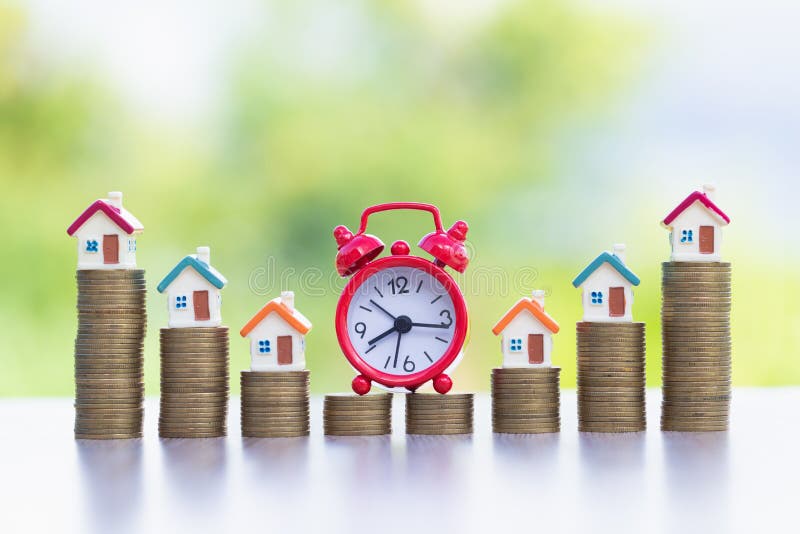 Mini house on stack of coins,Money and house, Mortgage, Savings money for buy house and loan to business investment for real royalty free stock photo Mini house on stack of coins,Money and house, Mortgage, Savings money for buy house and loan to business investment for real royalty free stock photo