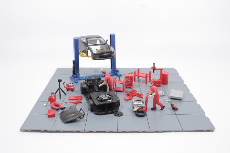 A Mini Mechanics Repairing Toy Car,concept of the Stock Image