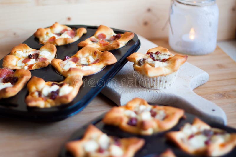 Mini Muffin Pizza Freshly Baked on a Wooden Cutting Board Stock Photo ...