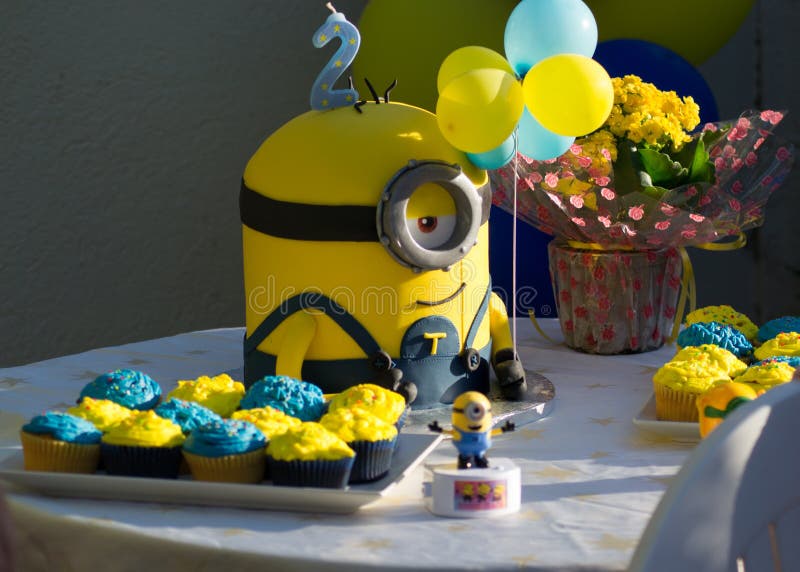 Varna, Bulgaria - July 25, 2020 - Children party concept, minions cake, second birthday celebration, yellow and blue as main colors. Varna, Bulgaria - July 25, 2020 - Children party concept, minions cake, second birthday celebration, yellow and blue as main colors