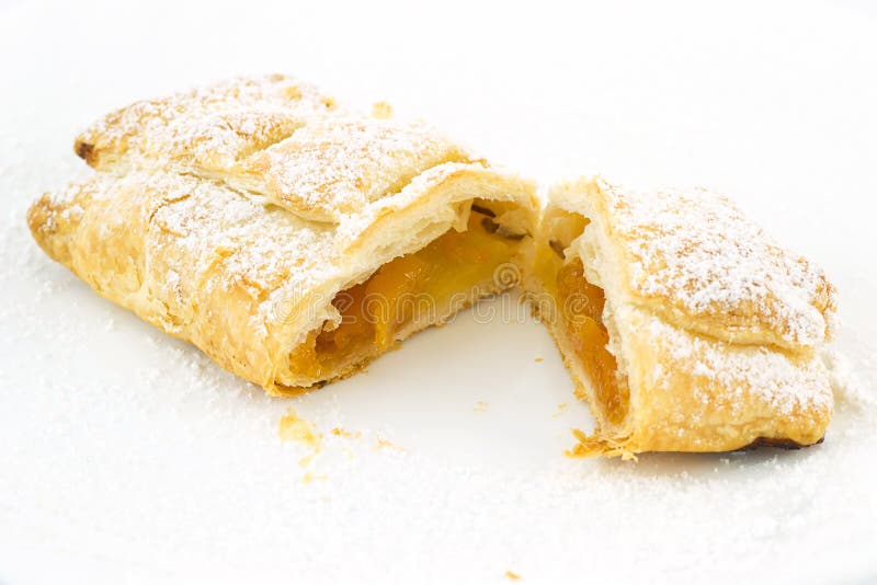 Sweet pastry strudel stuffed with apple. Sweet pastry strudel stuffed with apple