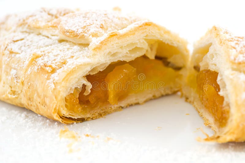 Sweet pastry strudel stuffed with apple. Sweet pastry strudel stuffed with apple