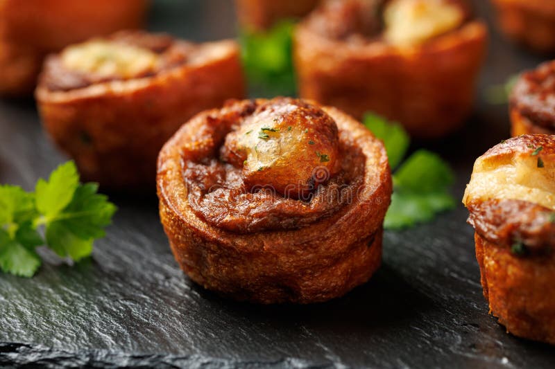 mini-yorkshire-puddings-with-shredded-beef-and-gravy-stock-photo
