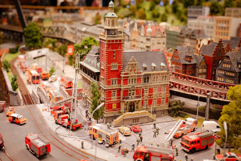Miniatur Wunderland Hamburg in Germany, fire brigade department extinguishes fire, burning house, museum with miniature model