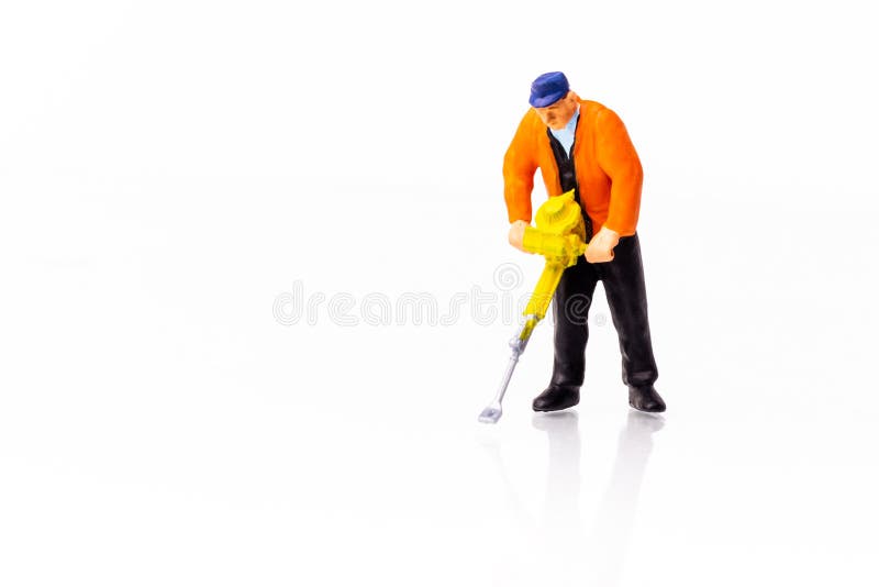 Miniature Builder worker with pneumatic hammer drill stock photos