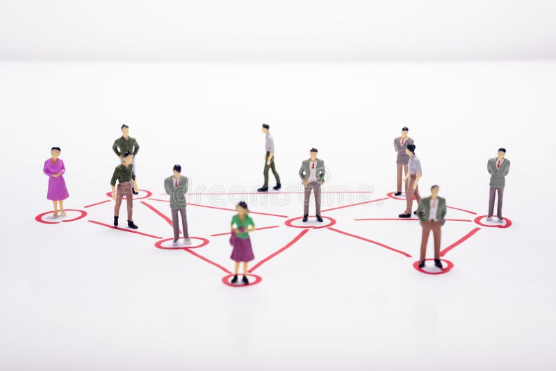 Miniature business people in conection scheme over white backdrop or background.