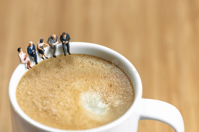 Miniature business team having a coffee break stock images