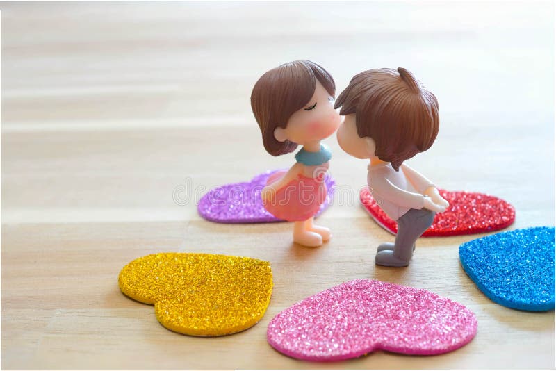 The Miniature Couple Dolls Boy and Girl Romantic Kiss with Heart Around the  Ground for Background for Valentine`s Day Concept Stock Image - Image of  cute, kiss: 169558259