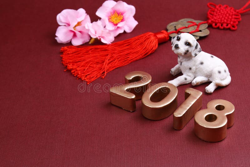 Miniature dog with chinse new year decorations 2018