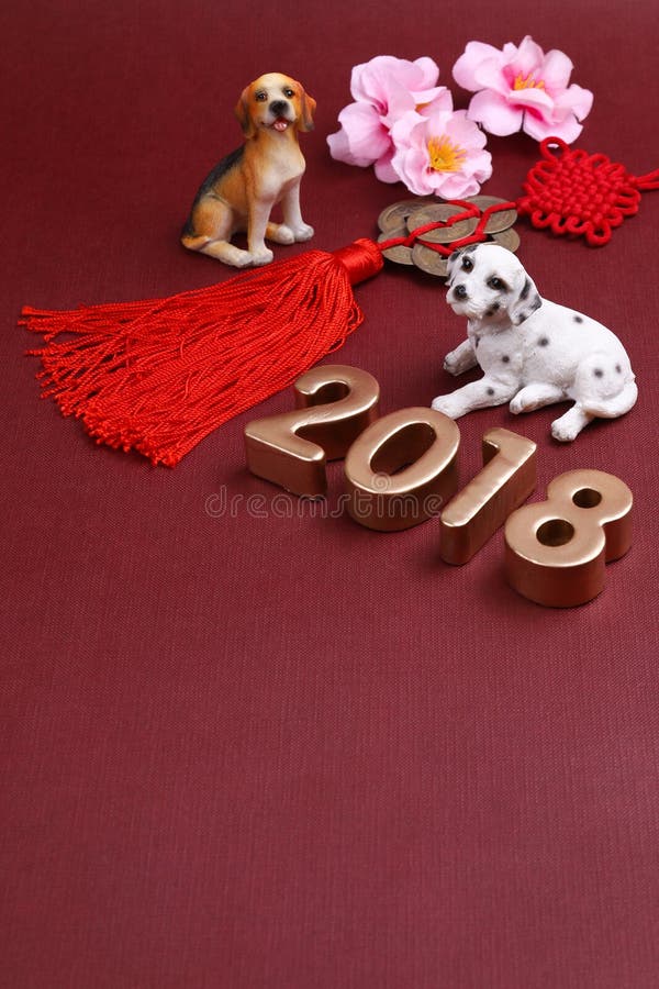 Miniature dogs with chinse new year decorations 2018