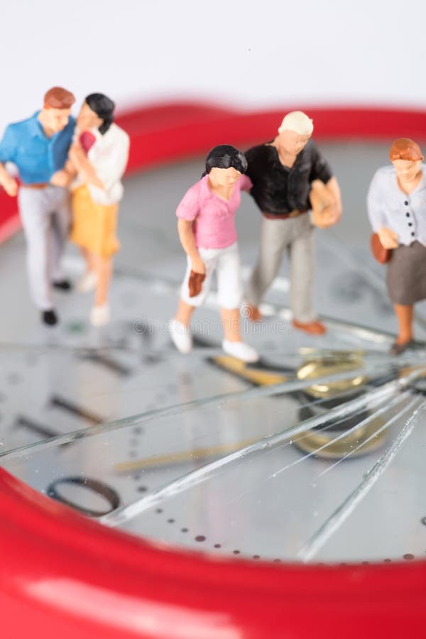 Miniature Doll Models of Different Age Groups Walk on the Cracked Alarm