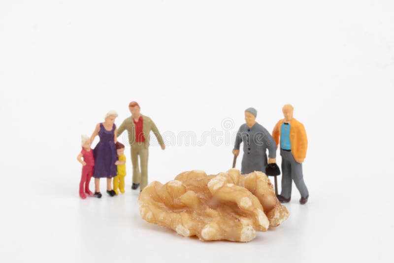 Miniature figurines of family on white background stock photo