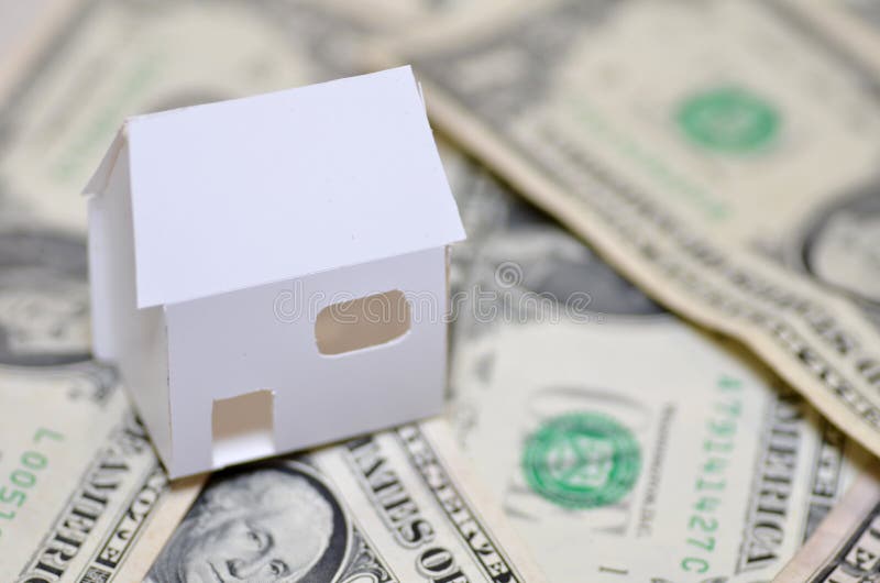 Miniature Paper Made House Stand On Money