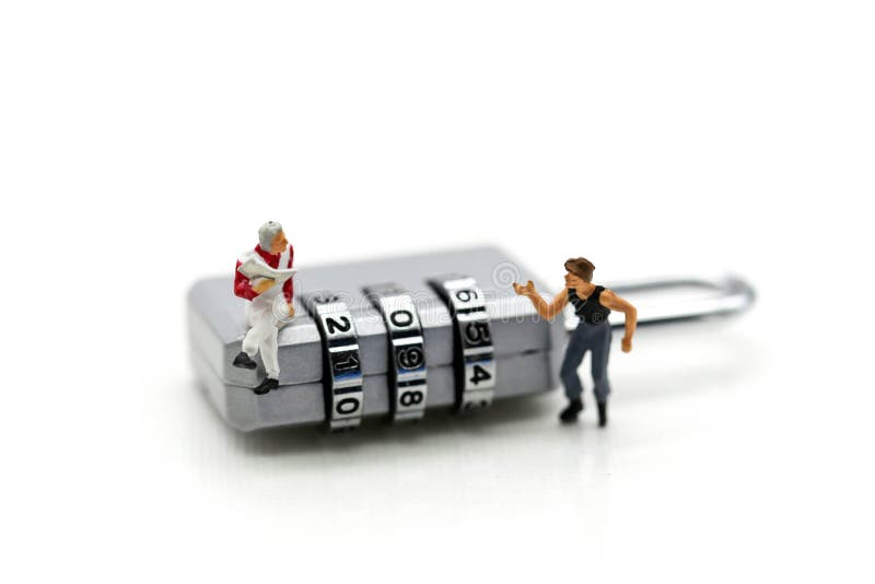Miniature people : businessman sitting on metal security lock key with thief. stock photo Miniature people : businessman sitting on metal security lock key with thief. stock photo