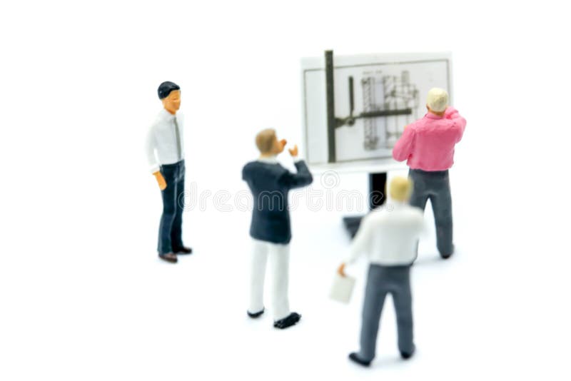 Miniature people : Businessman sitting with wooden block toy, E stock photos Miniature people : Businessman sitting with wooden block toy, E stock photos
