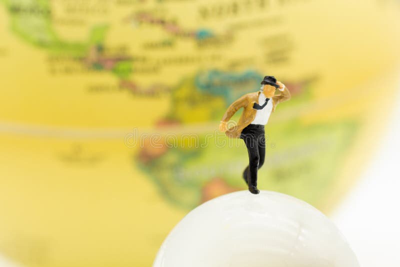Miniature people : Businessman standing with world map. Image use for business and travel concept royalty free stock photo Miniature people : Businessman standing with world map. Image use for business and travel concept royalty free stock photo