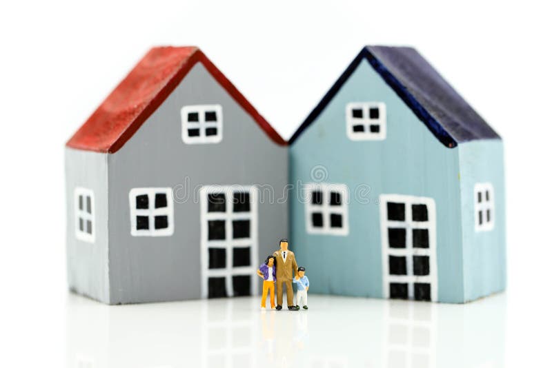 Miniature people : Family with house using as business, family and property concept stock photo Miniature people : Family with house using as business, family and property concept stock photo