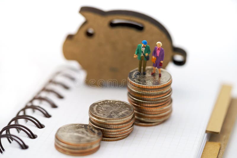 Miniature people: Happy old people standing on coins stack, Retirement planning, Emergency plan, Life insurance and Financial royalty free stock photo Miniature people: Happy old people standing on coins stack, Retirement planning, Emergency plan, Life insurance and Financial royalty free stock photo