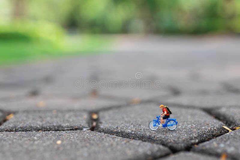 Miniature People : Travelers Riding Bicycle on the Road. Image Use for Background Traveling Business Concepts Stock Photo - Image of biking, health: 134445402 Miniature People : Travelers Riding Bicycle on the Road. Image Use for Background Traveling Business Concepts Stock Photo - Image of biking, health: 134445402
