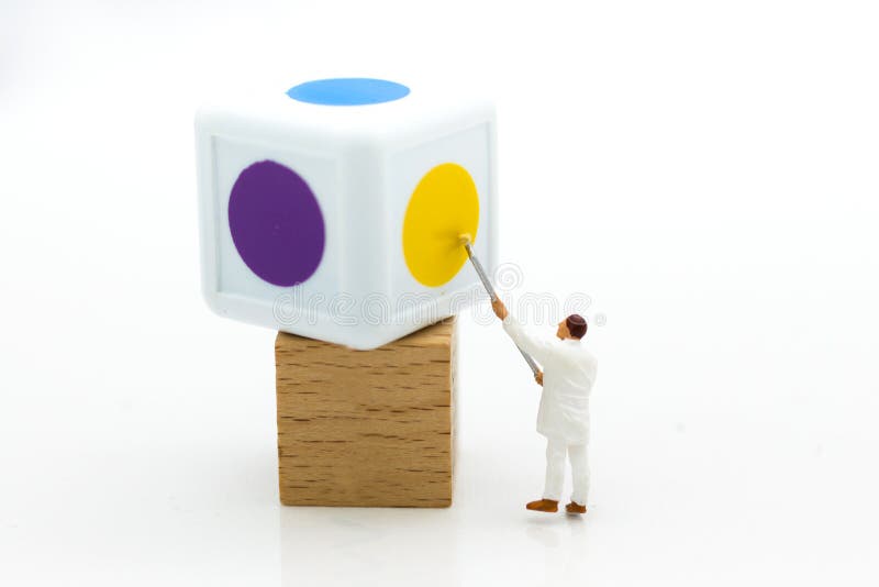 Miniature people: Worker painting color on dice. Image use for business concept.