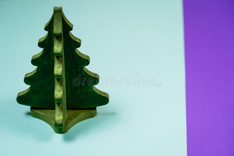 Miniature toy Christmas tree on a wooden table. Imitation realistic scene. royalty free stock images Miniature toy Christmas tree on a wooden table. Imitation realistic scene. royalty free stock images