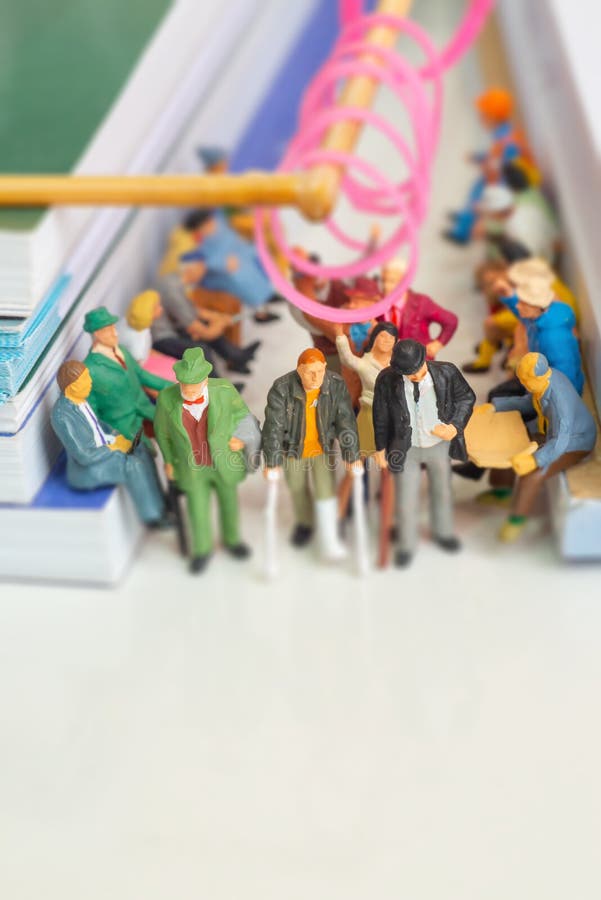 Miniature Toys of Disabled Man and Two Elderly Men in a Packed Public ...
