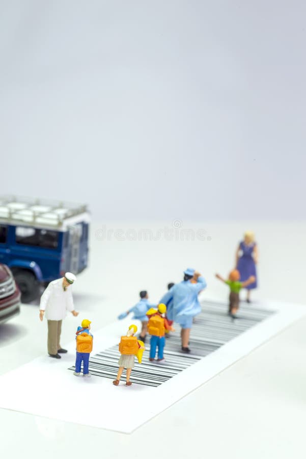 Miniature toys school kids walk on cross road bar code - school children road safety concept - top view royalty free stock photography Miniature toys school kids walk on cross road bar code - school children road safety concept - top view royalty free stock photography