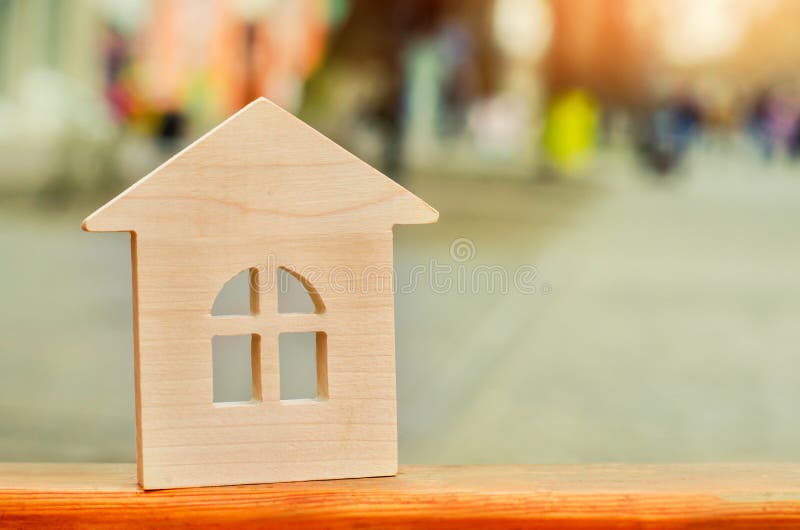 miniature wooden house. concept of real estate. sale of apartments. purchase of housing. apartments for rent. place for text. New stock photo miniature wooden house. concept of real estate. sale of apartments. purchase of housing. apartments for rent. place for text. New stock photo