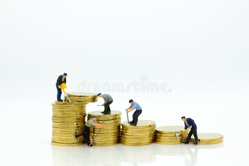 Miniature miniature : Worker and tools with golden stack of coins. Image use for finance, business concept
