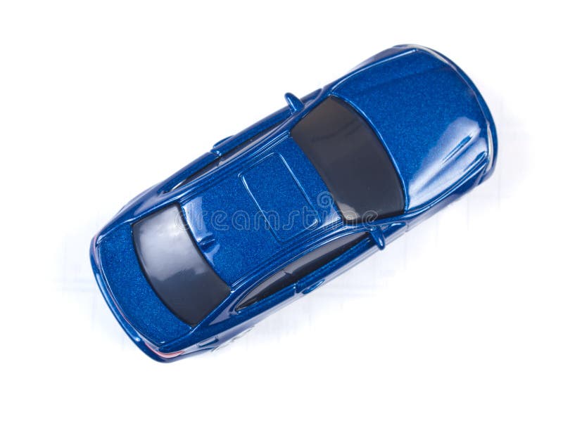 Miniatuur blauwe stuk speelgoed auto op witte achtergrond royalty-vrije stock fotografie Miniatuur blauwe stuk speelgoed auto op witte achtergrond royalty-vrije stock fotografie