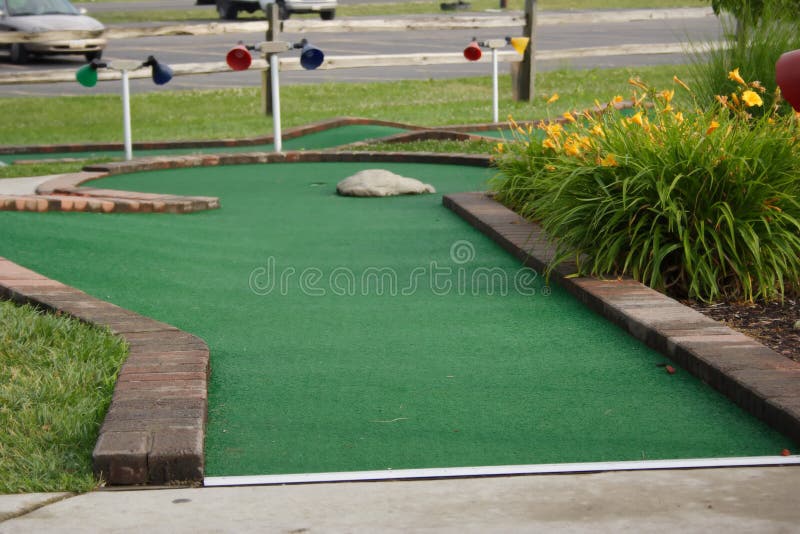 A hole at a miniature golf course. A hole at a miniature golf course