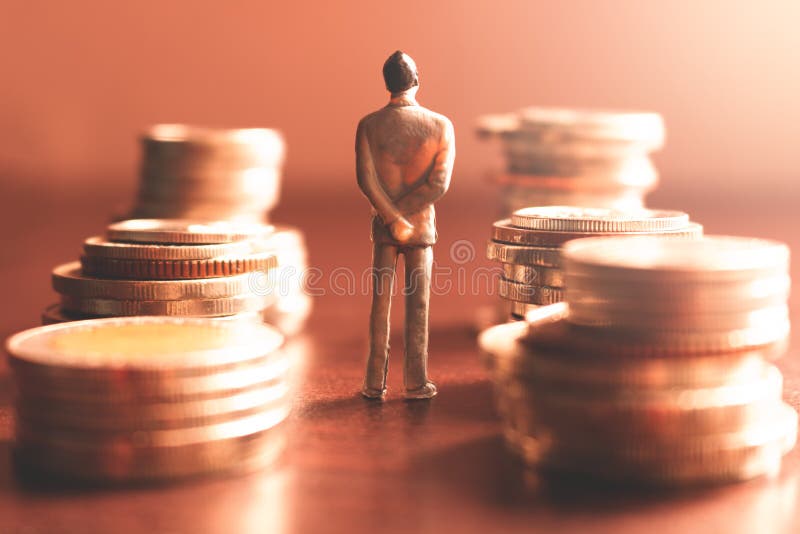 Miniature people standing with stack coin about financial and money savings concept. Miniature people standing with stack coin about financial and money savings concept.