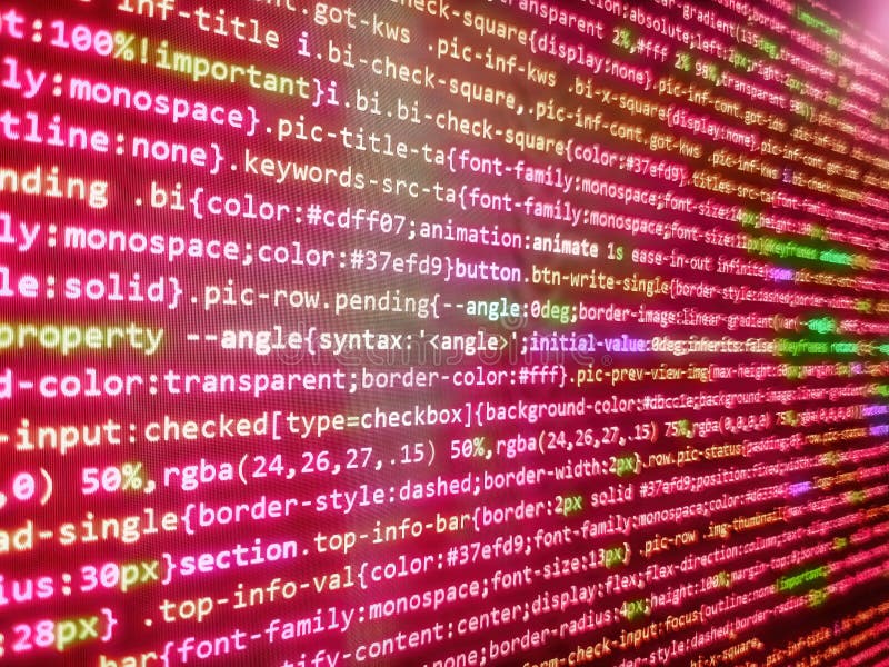 Minificated web development javascript code close up in sunset rays. Digital display screen of modern programmer coding work live stock photo