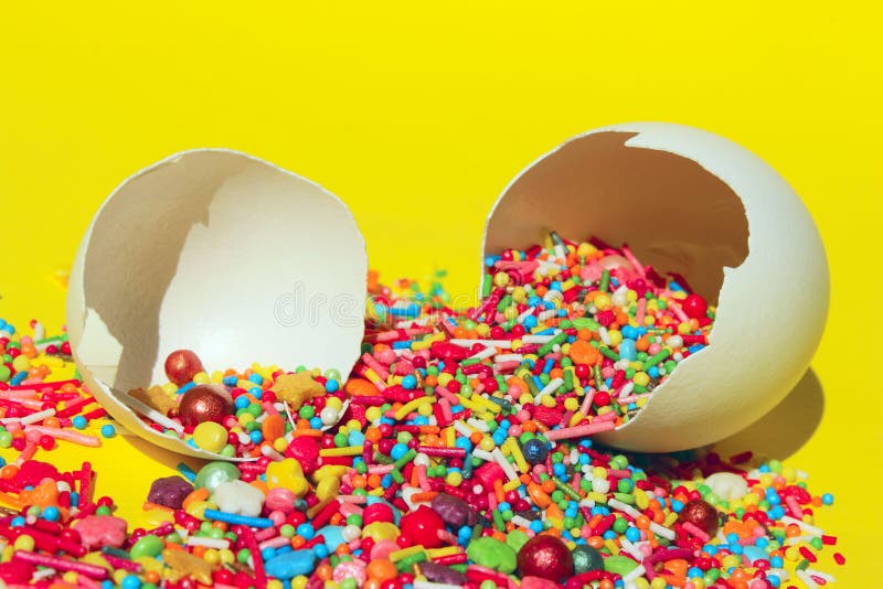 Minimal Art Design. Desserts, Holidays, Birthday Concept. Broken Eggs And Colorful Candies. stock photography Minimal Art Design. Desserts, Holidays, Birthday Concept. Broken Eggs And Colorful Candies. stock photography