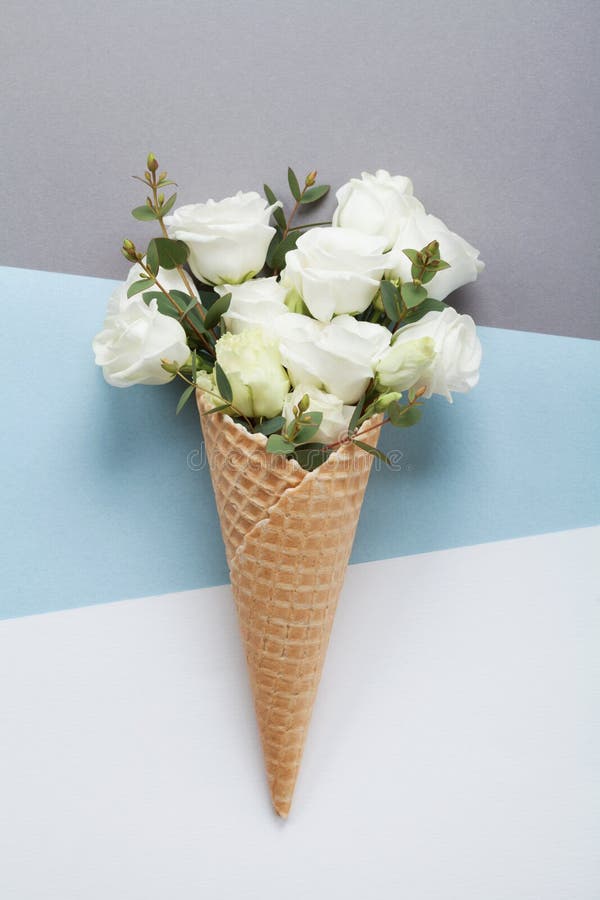 Minimal composition with creative ice cream of beautiful flowers on pastel paper top view. Flat lay. stock photo Minimal composition with creative ice cream of beautiful flowers on pastel paper top view. Flat lay. stock photo